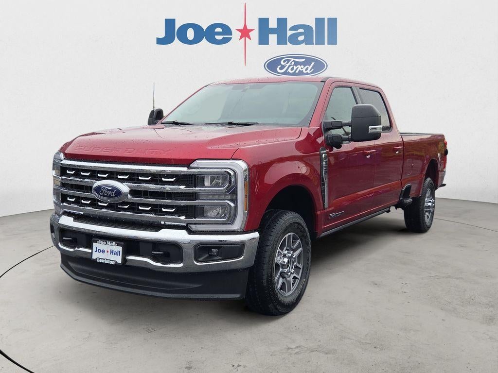 2026 Ford F-350 LARIAT in Ruby Red Metallic Tinted Clearcoat — front three-quarter view