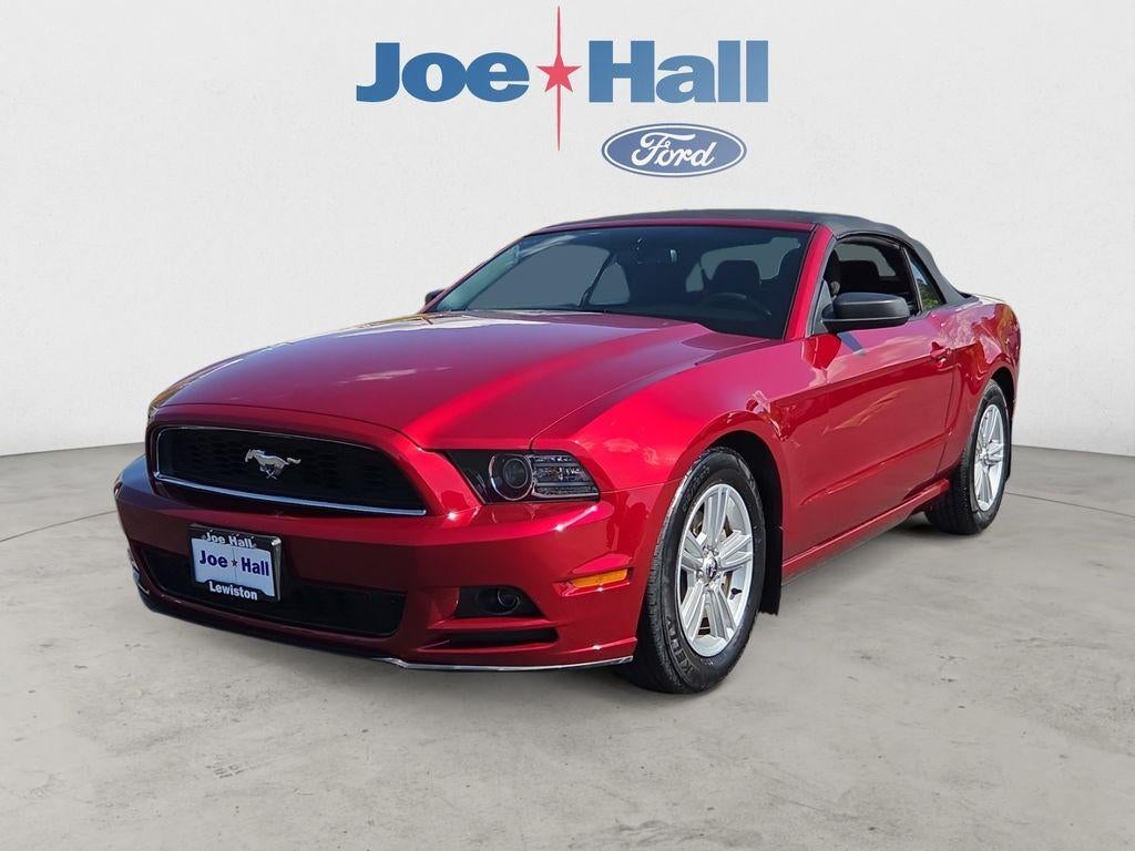 2014 Ford Mustang V6 in Ruby Red Metallic Tinted Clearcoat — front three-quarter view