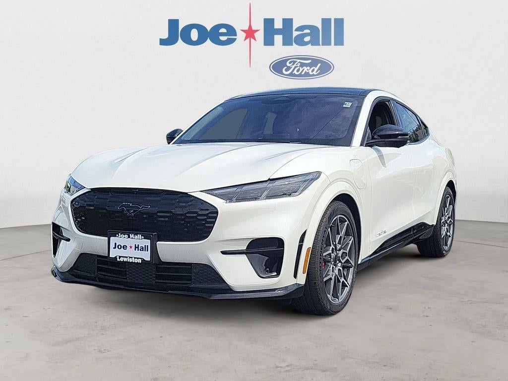 2025 Ford Mustang Mach-E GT in Star White Metallic Tri-Coat — front three-quarter view