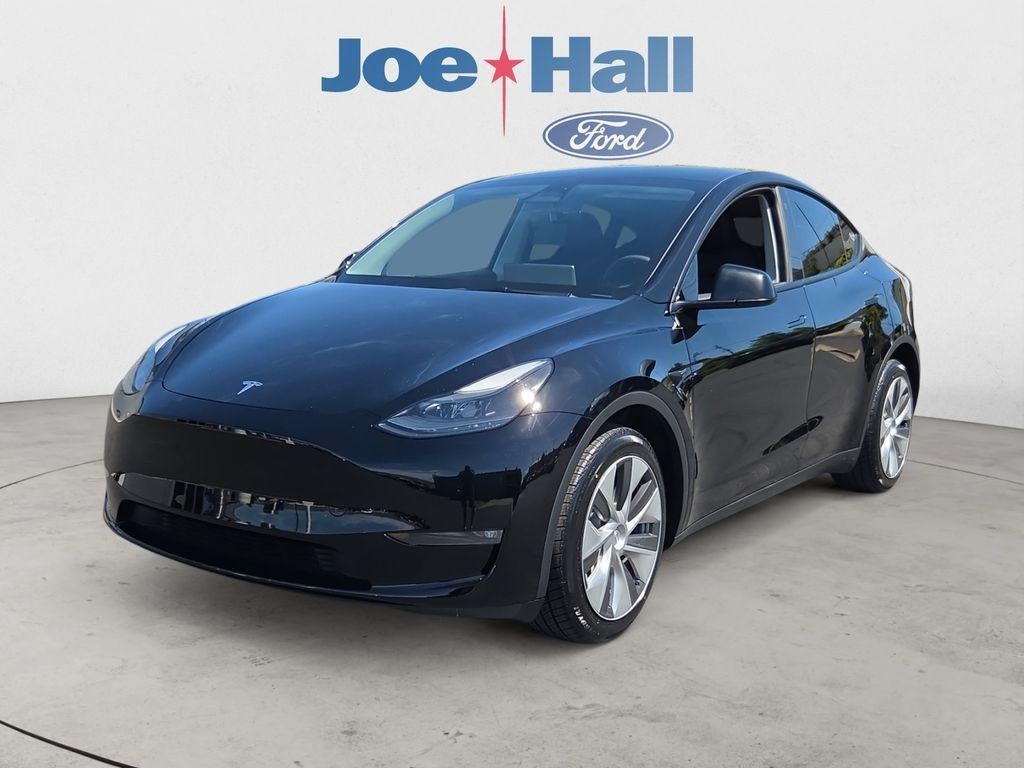 2023 Tesla Model Y Long Range in Solid Black — front three-quarter view